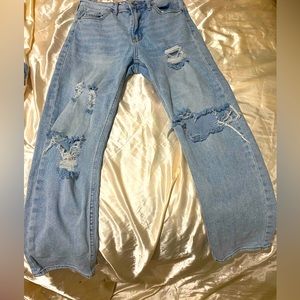 SUPER CUTE BLUE JEAN’S has rips at knees and thigh area biggie and wide